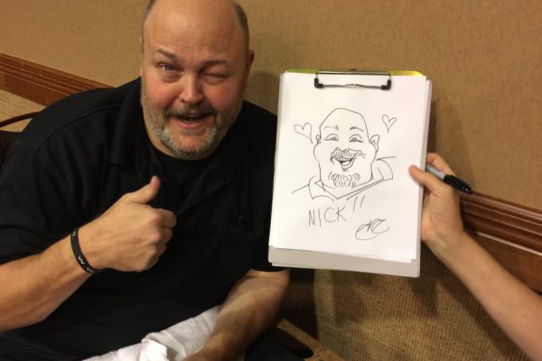 Nick-with-caricature-e1448383580280
